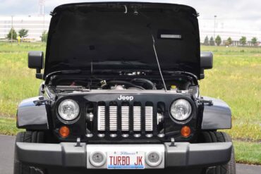 Black JK Jeep Wrangler with hood open