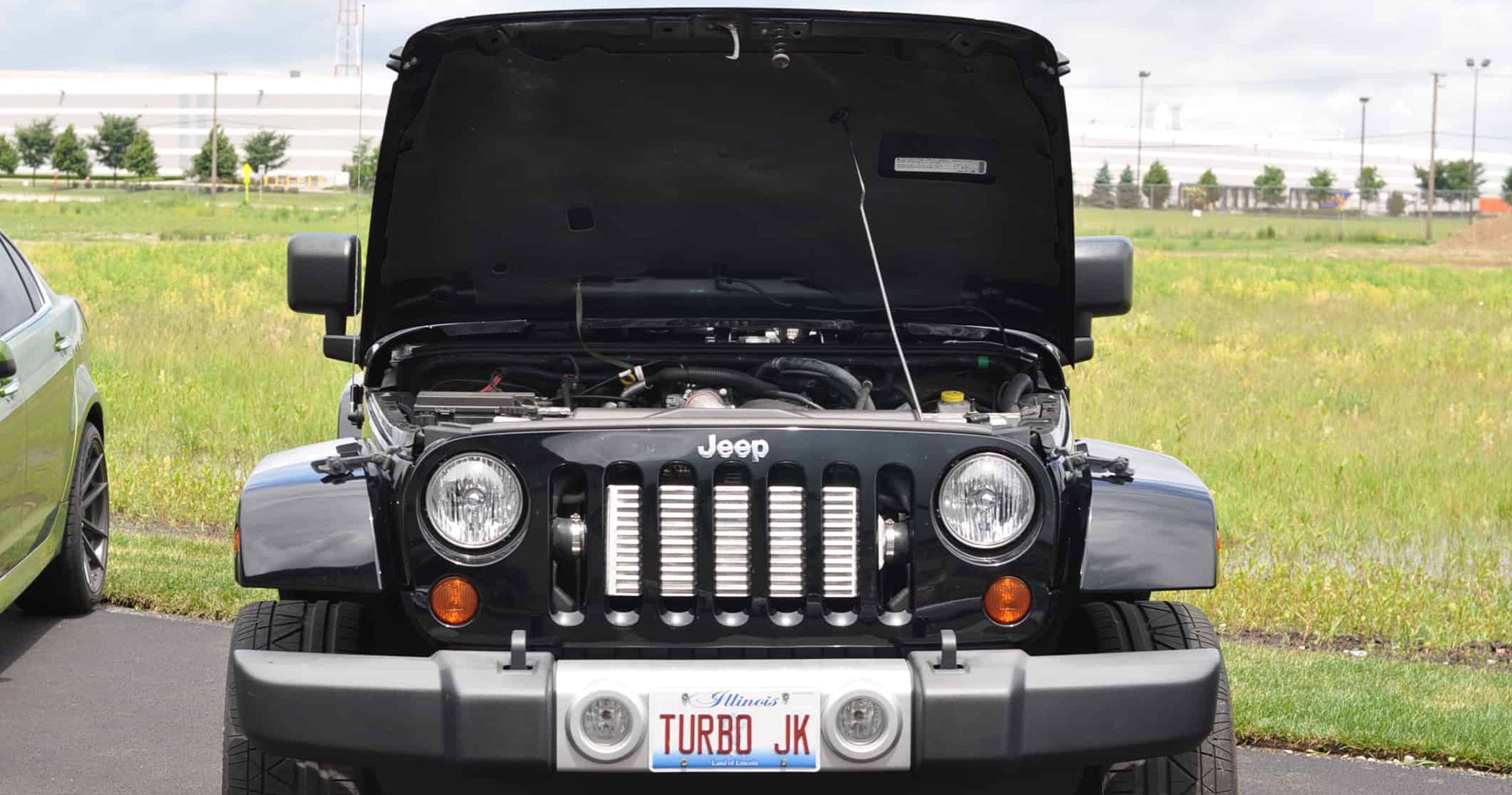 Black JK Jeep Wrangler with hood open