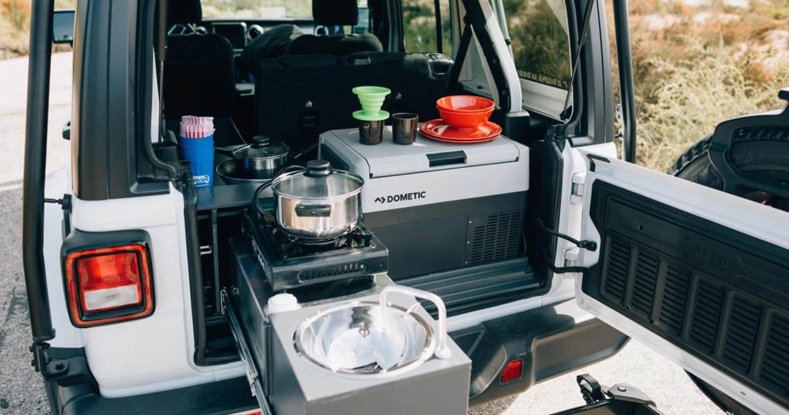 Trunk of a Jeep with outdoor camping kitchen