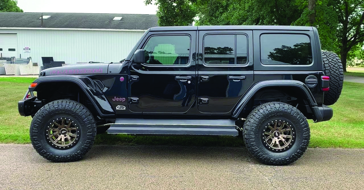 Black Jeep Rubicon with electric running boards