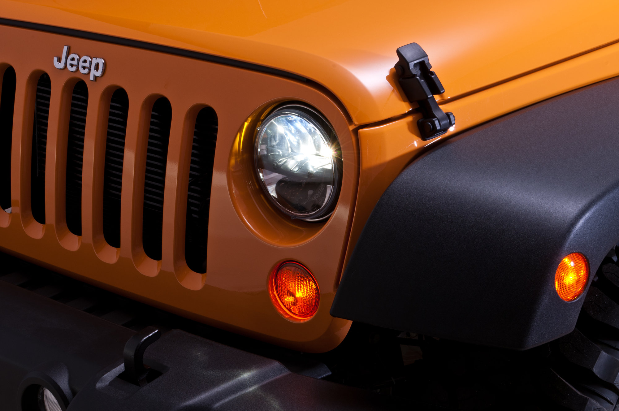 Rigid Industries LED Headlights on orange Jeep Wrangler