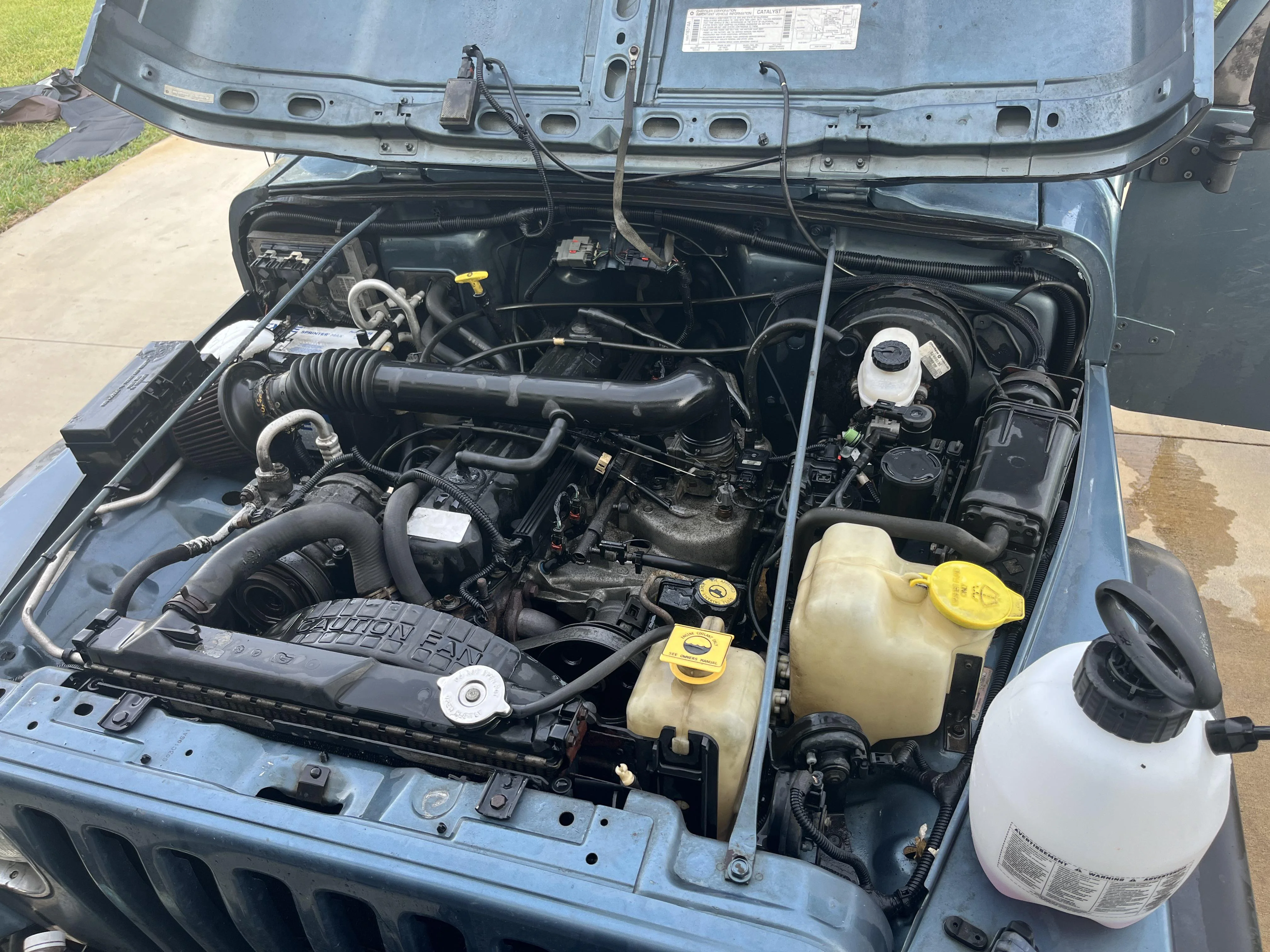 Engine bay of a 1999 Jeep Wrangler TJ